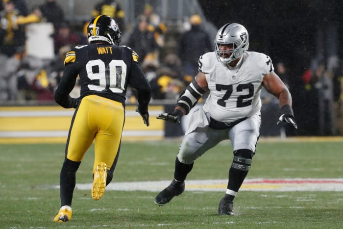 Dec 24, 2022; Pittsburgh, Pennsylvania, USA; Las Vegas Raiders guard Jermaine Eluemunor (72) prepares to block at the line of scrimmage against Pittsburgh Steelers linebacker T.J. Watt (90) during the first quarter at Acrisure Stadium. Mandatory Credit: Charles LeClaire-USA TODAY Sports